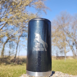 May include: A black and silver insulated tumbler with a glitter finish. The tumbler has a unicorn graphic and the text "I'm not weird, I'm a unicorn".
