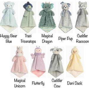 May include: A collection of plush baby security blankets in various animal designs, including a bear, triceratops, dragon, dog, raccoon, unicorn, butterfly, cow, and duck. Each blanket features a soft, textured fabric and a character head.