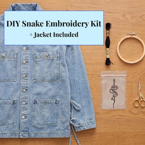 May include: A light blue denim jacket with four front pockets and a DIY snake embroidery kit. The kit includes black thread, a wooden embroidery hoop, a needle, and small gold scissors. The text on the image reads: DIY Snake Embroidery Kit + Jacket Included.