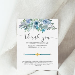 May include: A thank you card with a blue and green floral design. The card includes a blue string bracelet with a gold cross charm. The text on the card reads "Thank you for celebrating with us! Avery's Confirmation September 17th, 2023". The text below the bracelet reads "Tie this bracelet around your wrist and wear as a reminder that you are wonderfully made, dearly loved, and precious in his sight. - Psalm 139"