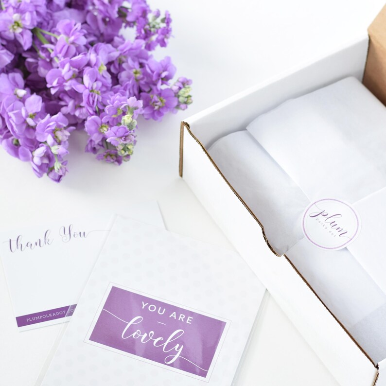 a box that has some purple flowers in it