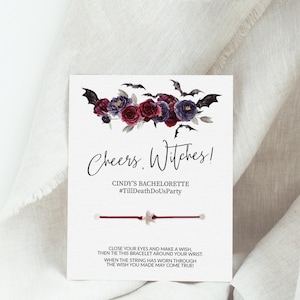 May include: A red and white string bracelet with a silver star charm. The card reads "Cheers. Witches! Cindy's Bachelorette #TillDeathDoUsParty". Close your eyes and make a wish, then tie this bracelet around your wrist. When the string has worn through, the wish you made may come true!"