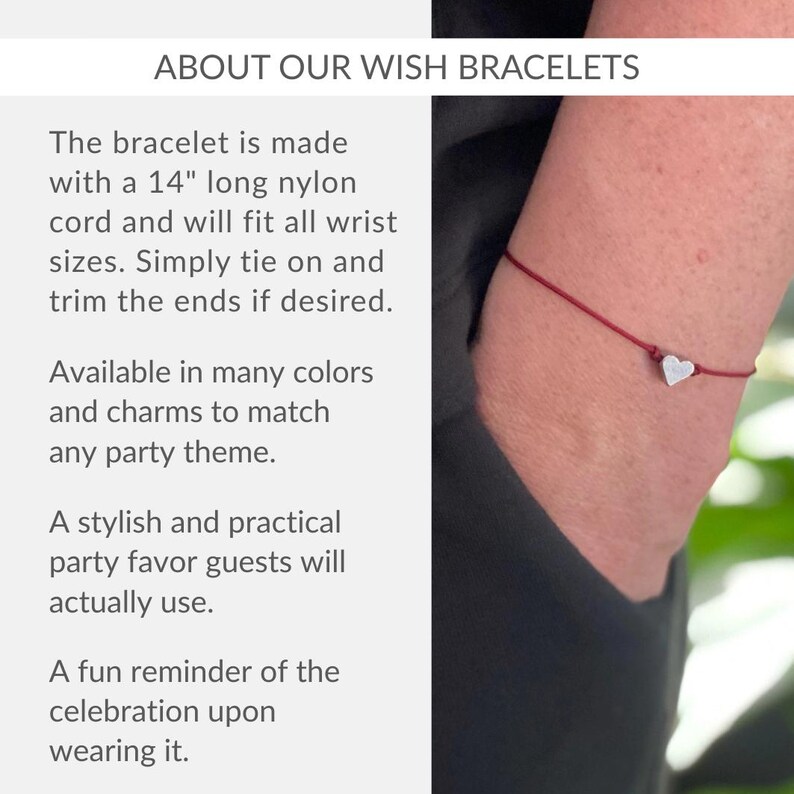 a woman wearing a bracelet with a heart on it