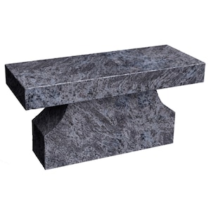 May include: A gray granite bench with a rectangular top and a base with two rounded sides. The bench is made of a natural stone with a unique pattern.