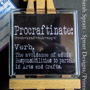 May include: A black and white sign with the word "Procraftinate" defined as "The avoidance of adult Responsibilities to partake in Arts and Crafts."