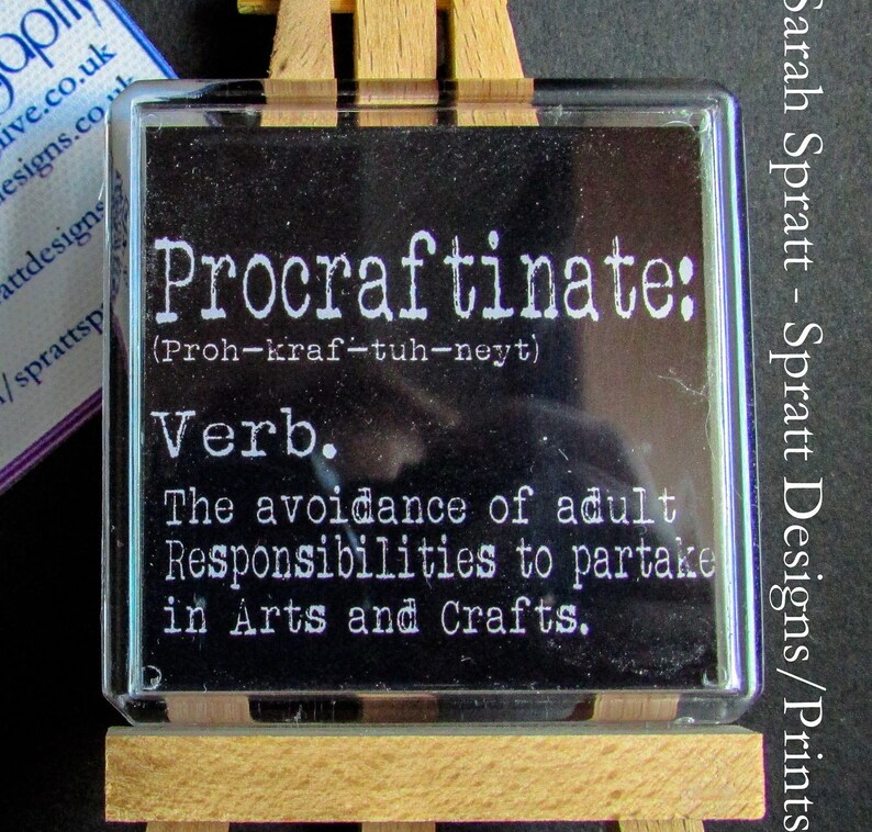 May include: A black and white sign with the word "Procraftinate" defined as "The avoidance of adult Responsibilities to partake in Arts and Crafts."