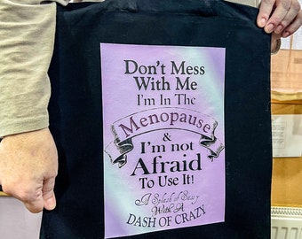 Fun Menopause warning tote bags in two designs available in black or white eco cotton