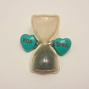 Celluloid Kissing Timer Brooch
