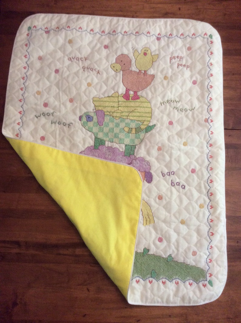 Cuddly animal stack cross stitched baby quilt finished