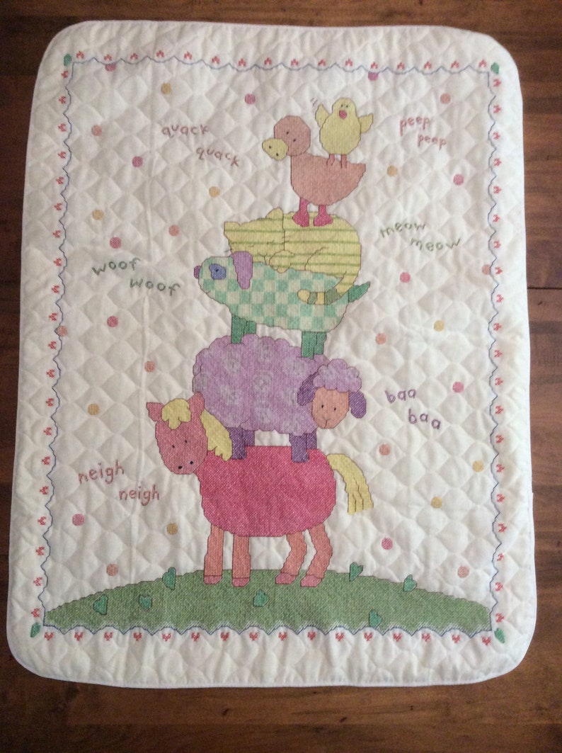 Cuddly animal stack cross stitched baby quilt finished