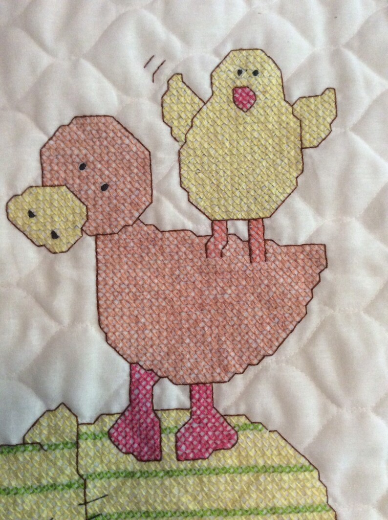 Cuddly animal stack cross stitched baby quilt finished