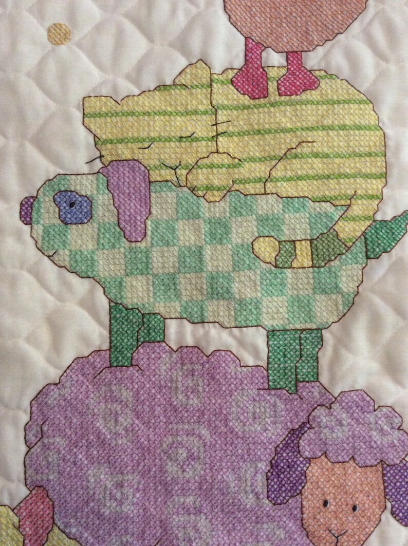 Cuddly animal stack cross stitched baby quilt finished