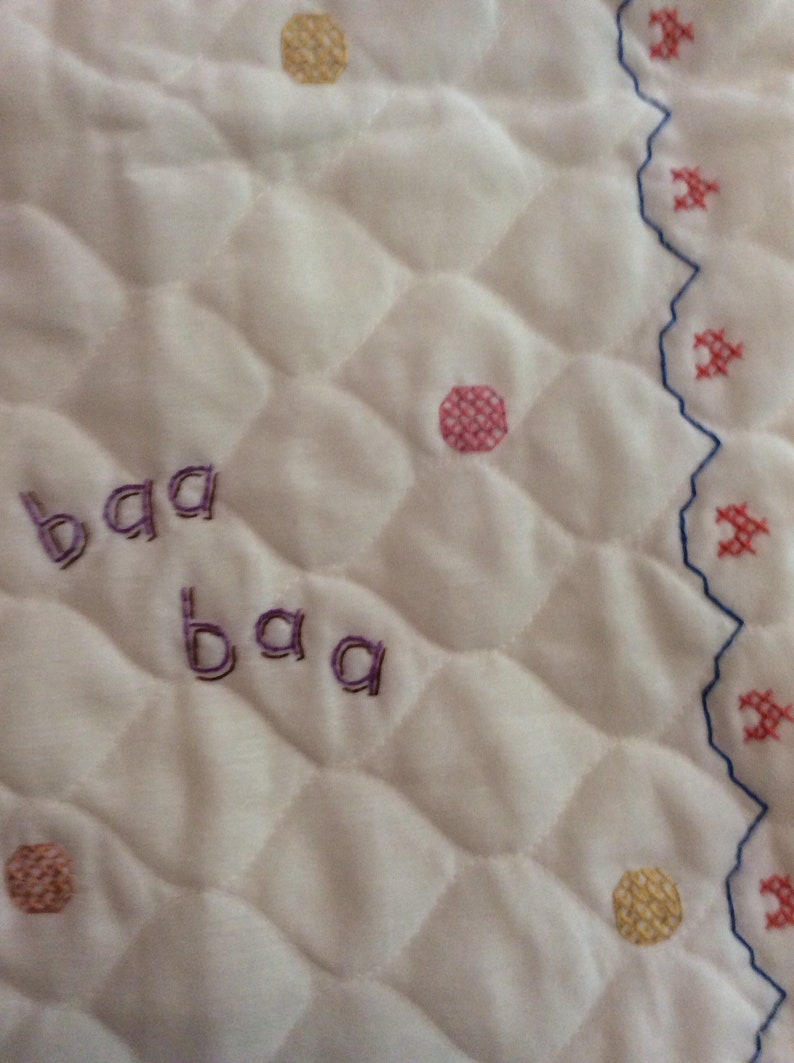 Cuddly animal stack cross stitched baby quilt finished