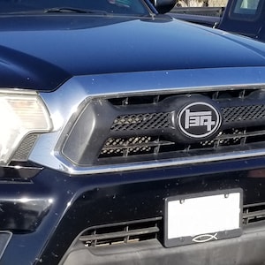 2011-2015 Tacoma TEQ Grille Badge