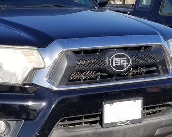 2011-2015 Tacoma TEQ Grille Badge