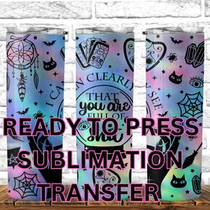 May include: Three stainless steel tumblers with a holographic rainbow background and black and white designs. The designs include a dream catcher, tarot cards, and a pentacle. The text on the tumblers reads "I can clearly see that you are full of magic". The tumblers are ready to press sublimation transfers.