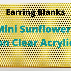 May include: Earring blanks featuring mini sunflowers on clear acrylic. The background is a white and yellow pattern of small sunflowers.