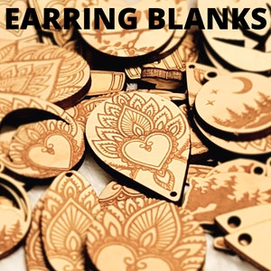 May include: Assortment of wooden earring blanks with various laser-etched designs, including floral patterns, hearts, and moons. The blanks are light brown and have a natural wood finish. "EARRING BLANKS" is written in black text at the top of the image.
