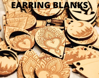 May include: Assortment of wooden earring blanks with various laser-etched designs, including floral patterns, hearts, and moons. The blanks are light brown and have a natural wood finish. "EARRING BLANKS" is written in black text at the top of the image.