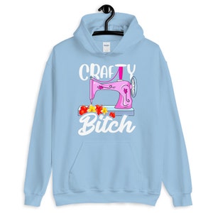 Crafty Bitch Sewing Machine For Creative Women Who Sew Unisex Hoodie Light Blue