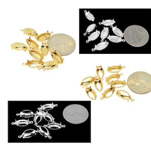 May include: A set of 10 gold, silver, and rhodium plated oval bezel settings for jewelry making. The bezels are shown next to US quarters for size comparison.
