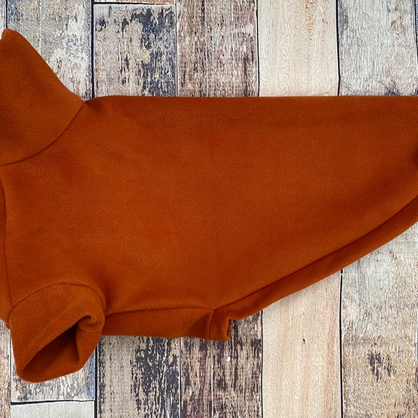 Rust Greyhound Clothing, cosy made to measure fleece pyjamas for lurchers, whippets, sighthounds. Orange dog sweater
