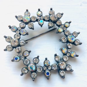 May include: A set of three ceramic mugs with a speckled, matte finish. The mugs are in shades of cream, light gray, and dark gray. Each mug has a simple, minimalist design, perfect for coffee or tea.