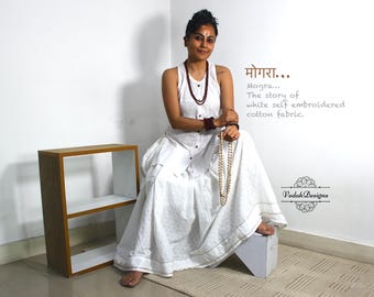 White self-embroidered skirt top set in soft cotton fabric
