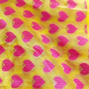 Yellow and pink net jacquard fabric sold by the yard