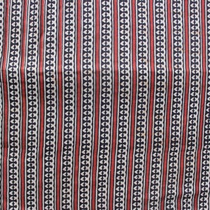 May include: A textile fabric featuring a repeating vertical pattern of alternating dark navy blue and deep red stripes. The navy blue stripes contain a white geometric chain-link motif, while the red stripes are solid and separated by thin white lines.