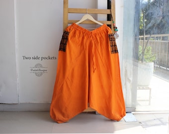 Pomarańczowe spodnie haremowe khadi unisex z kieszeniami bocznymi