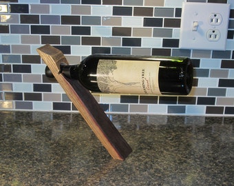 Balancing wine bottle holder - reclaimed wine barrel stave