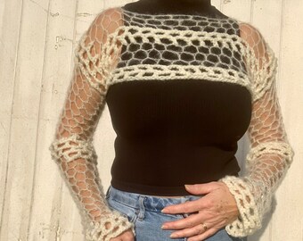 Crochet shrug in a mesh stitch cream in colour. Made with two types of wool.