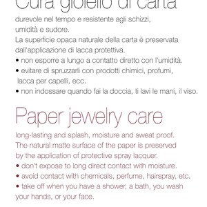 May include: White background with text in Italian and English. The text provides care instructions for paper jewelry. Instructions include avoiding moisture, chemicals, and removing the jewelry before showering.