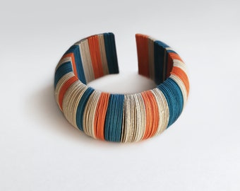 Paper jewel, circle bracelet, colored with striped design, contemporary jewel