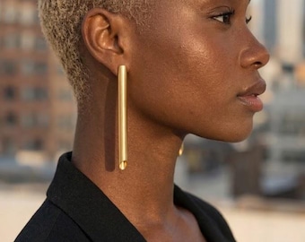 Large gold plated tube statement earrings with sterling silver studs for a modern minimalist look
