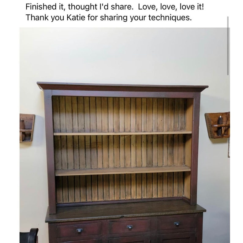 May include: A dark brown wooden hutch with three shelves and a cabinet base. The hutch has a rustic, farmhouse style with vertical wooden slats in the back. The text in the image says, "Finished it, thought I'd share. Love, love, love it! Thank you Katie for sharing your techniques."