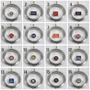 May include: A set of 16 silver locket charms with different baseball team logos. The charms are arranged in a grid of four rows and four columns. Each charm has a clear glass front and a silver back. The logos are visible through the glass.
