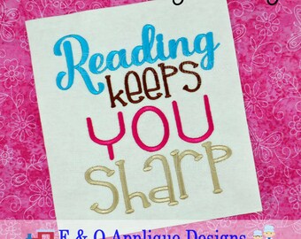 May include: A white embroidery design with the text "Reading keeps you sharp" in blue, brown, pink, and gold thread. The design is on a pink background with white floral patterns.