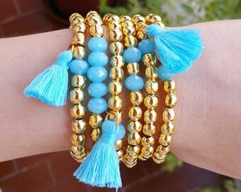 Golden metal beads - tassel jewelry - multiple tassels - golden bead - golden bracelets - stretch bracelet - faceted gemstone - light blue