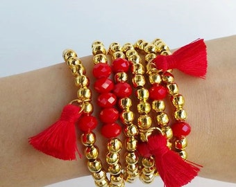 Golden metal beads - tassel jewelry - multiple tassels - golden bead - golden bracelets - stretch bracelet - faceted gemstone - red bracelet