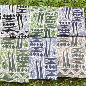 May include: Four fabric swatches with different geometric patterns. The patterns are black and white, green and white, blue and white, and brown and white.