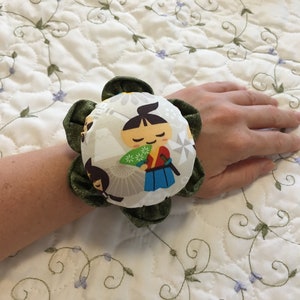 Oriental Boy Wrist Pin Cushion