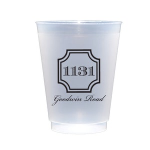 May include: A white plastic cup with a black design. The design features a square with rounded corners and the number "1131" inside. Below the square is the text "Goodwin Road".