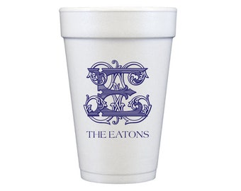 May include: White foam cup with a blue monogram of the letter "E" with decorative flourishes and the text "THE EATONS" printed below.