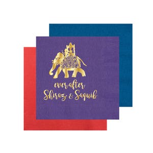 May include: Purple and red paper napkins with a gold elephant design and the text "ever after Shiraz & Saquib".
