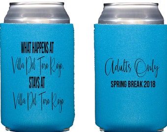 May include: Two blue can coolers with black text. One cooler says "What happens at Villa Del Toro Rojo, stays at Villa Del Toro Rojo". The other cooler says "Adults Only Spring Break 2018".