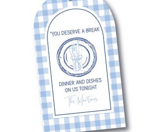 May include: A blue and white gingham gift tag with a rounded top. The tag features a blue circular design with a plate, fork, and knife illustration. Text on the tag reads "YOU DESERVE A BREAK" and "DINNER AND DISHES ON US TONIGHT".