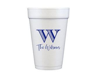 May include: White foam cup with a blue and white striped letter W and the text "The Wilsons" printed on the side.