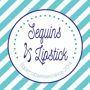 May include: A white circle with a blue border and blue text that reads "Sequins & Lipstick Paper obsessed since 2014."